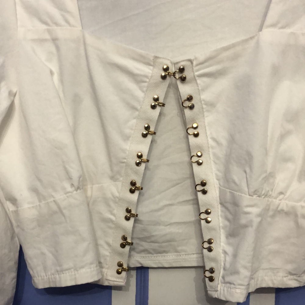 White Puff-Sleeve Top with gold hook clasps